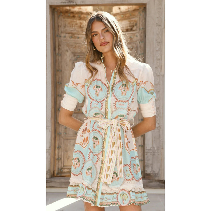 Women’s short sleeve dress with decorative button placket and playful ruffle