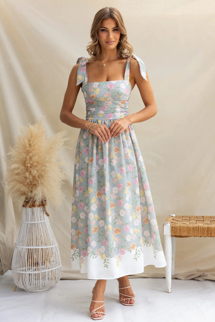 Women's maxi dress with playful straps and floral print