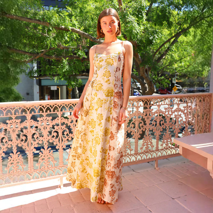 Women's Long Floral Dress with Adjustable Spaghetti Straps and Flowing Cut