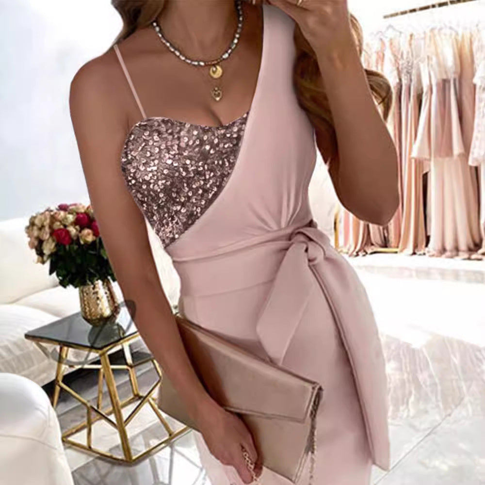 Women's fitted dress with shimmering top and waist belt