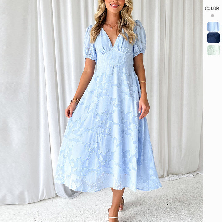 Women's maxi dress with floral accents and voluminous puff sleeves
