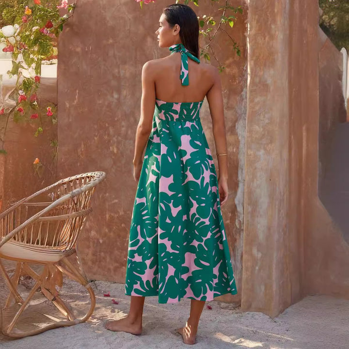 Women's maxi dress with floral bandeau design and elegant flared skirt