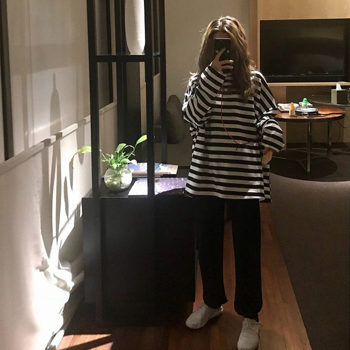 Women's striped long-sleeve shirt with a loose fit and modern details