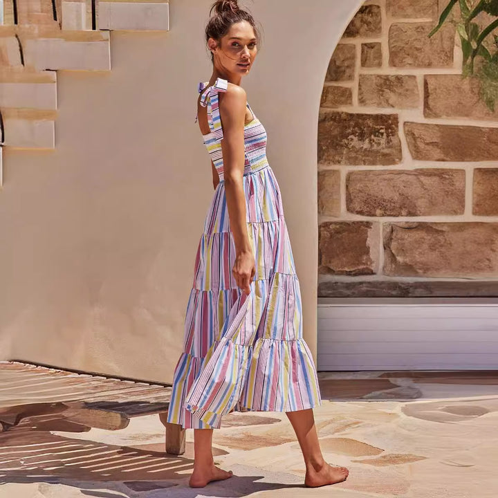 Women's maxi dress with flattering smocked top and playful straps