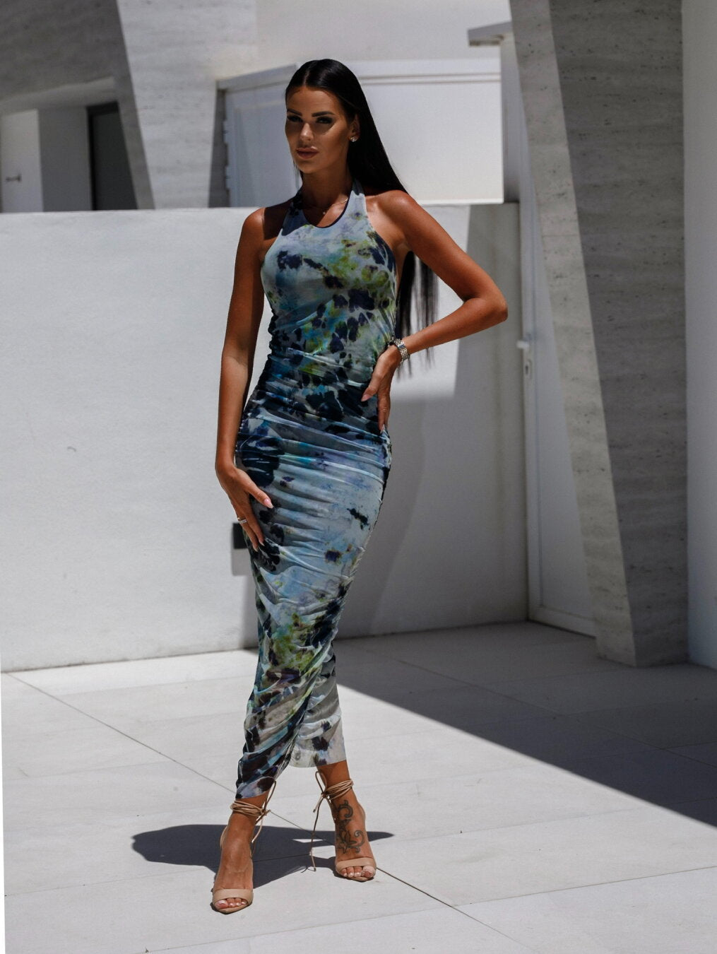 Women's fitted maxi dress with elegant wrap design and modern tie-dye pattern