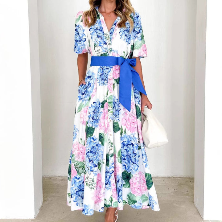Women's maxi dress with pleats and waist belt