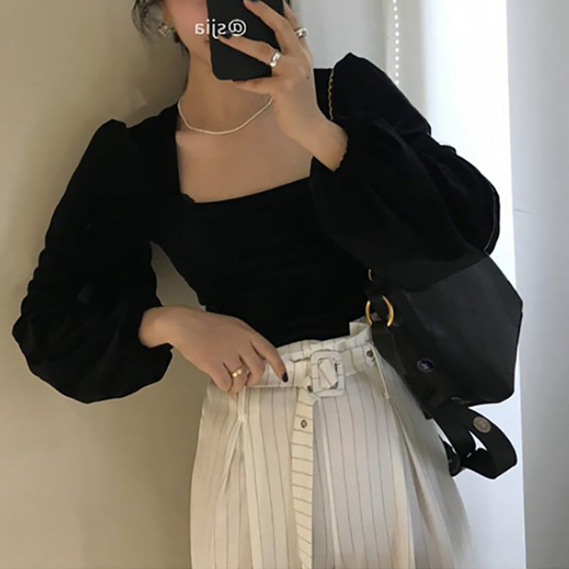 Women's elegant top with square neckline and decorative puff sleeves