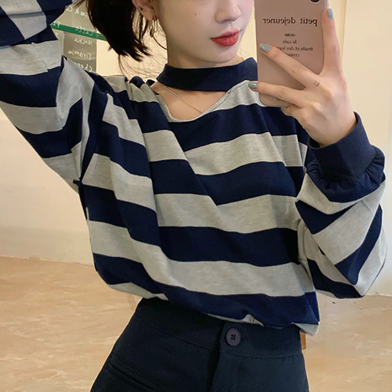 Women’s long sleeve shirt with modern stripes and an elegant neckline