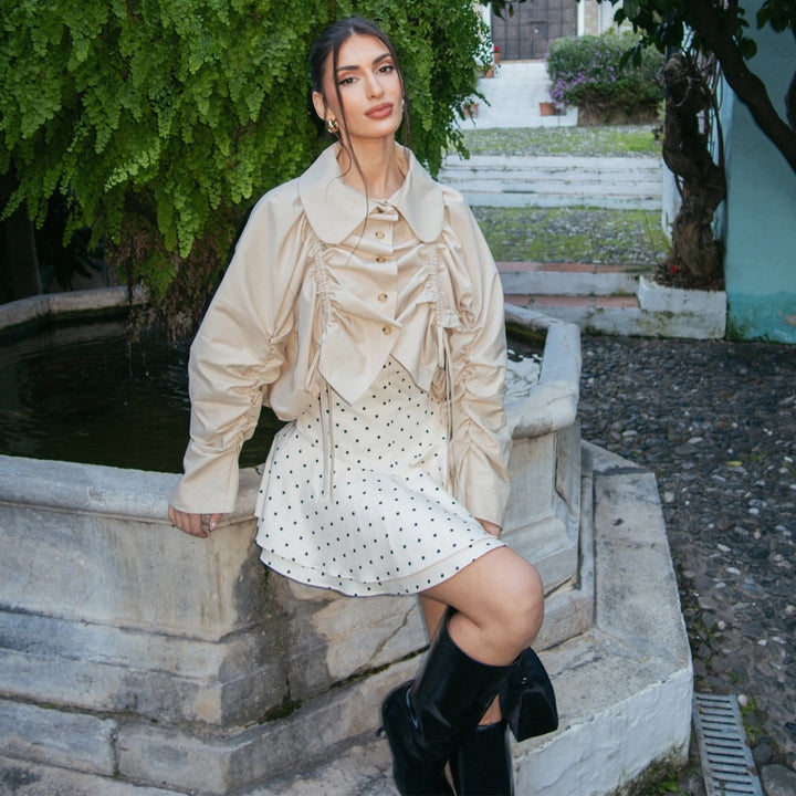 Ladies fashionable top with elaborate gathers and wide collar
