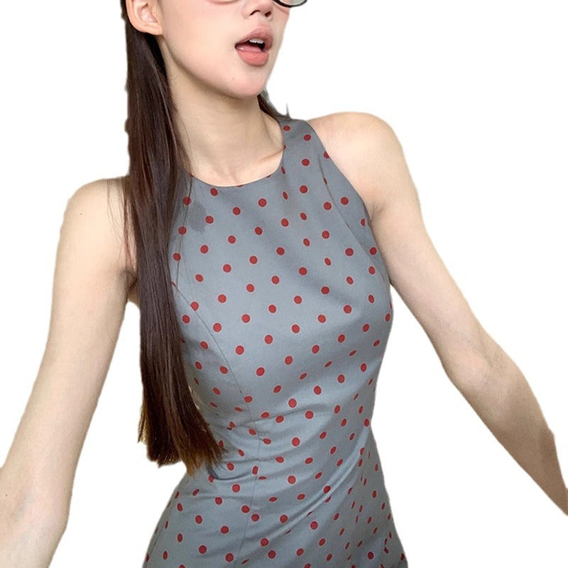 Women's sheath dress with polka dot pattern and figure-hugging cut