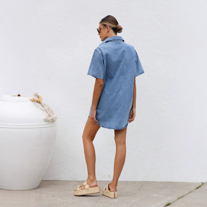 Women’s denim shirt dress with short sleeves and practical pockets