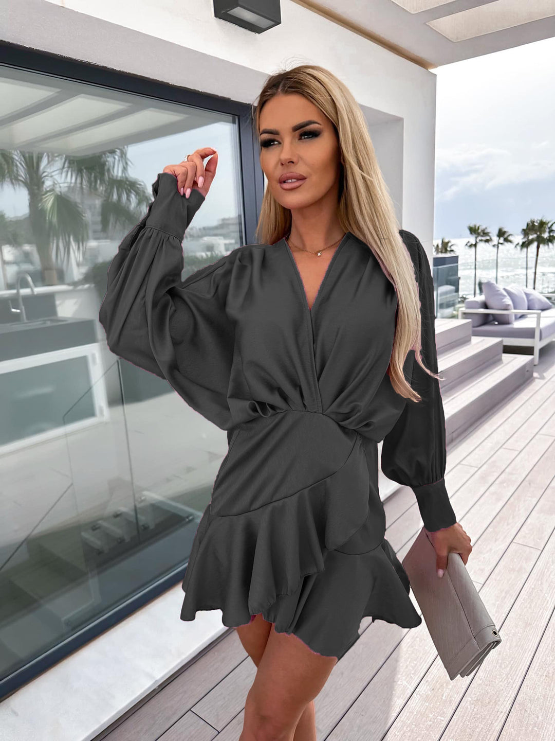 Women's wrap dress with voluminous sleeves and flowing hem