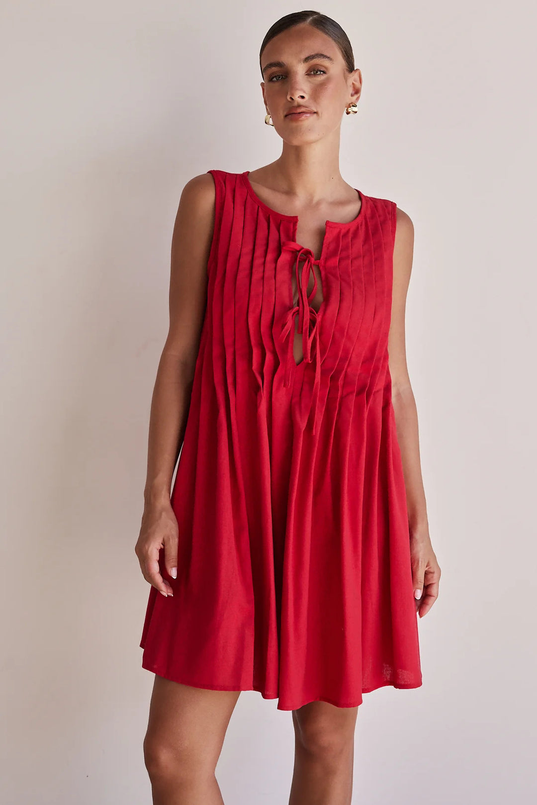 Ladies A-line dress with playful knot and refined pleats Lune London
