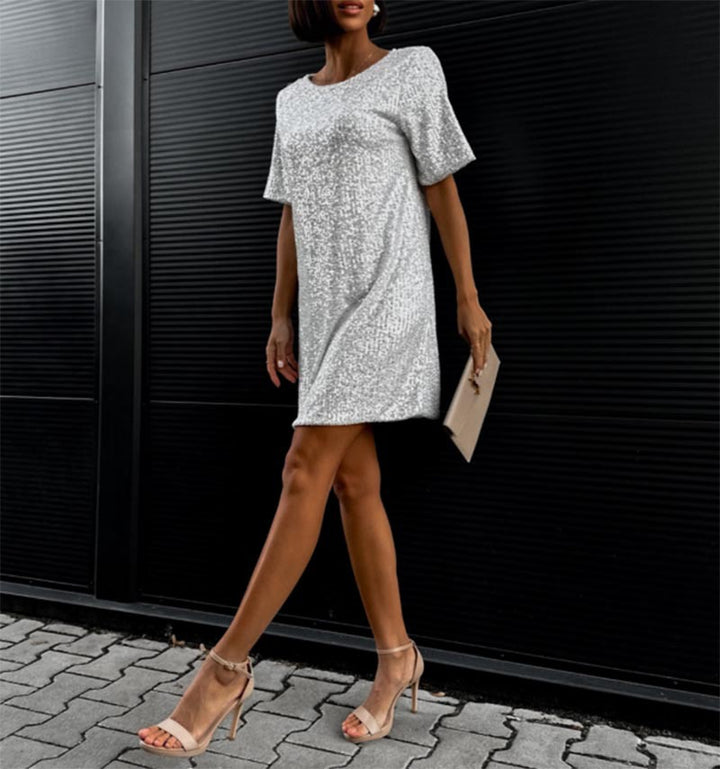 Women's festive cocktail dress made of sparkling material with a light A-line cut