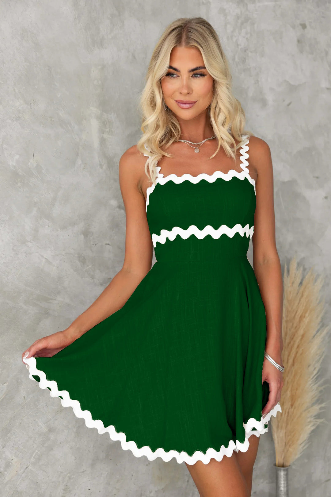 Women's casual dress with voluminous ruffles and decorative wave hem