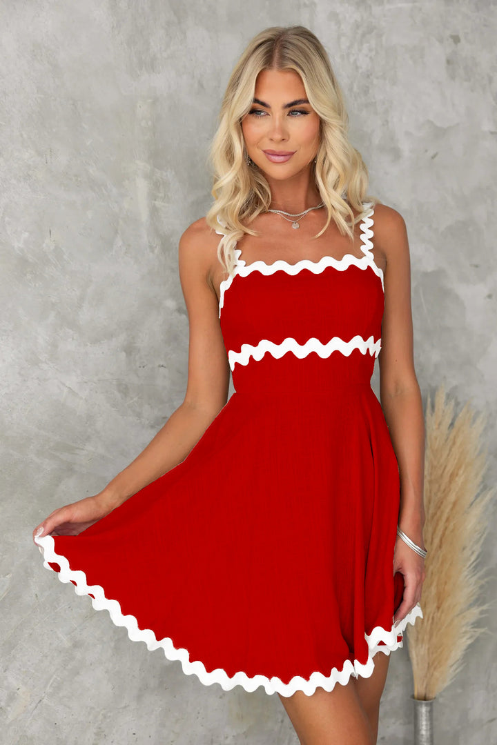 Women's casual dress with voluminous ruffles and decorative wave hem