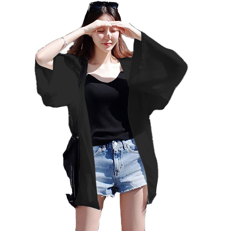 Ladies elegant kimono jacket with a loose fit and intricately designed sleeves