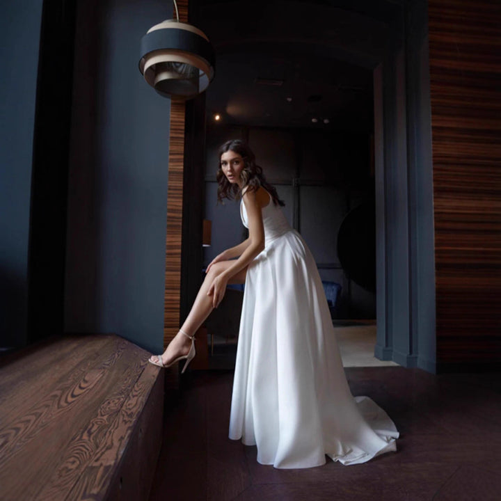 Women's elegant wedding dress with deep V-neckline and side slit