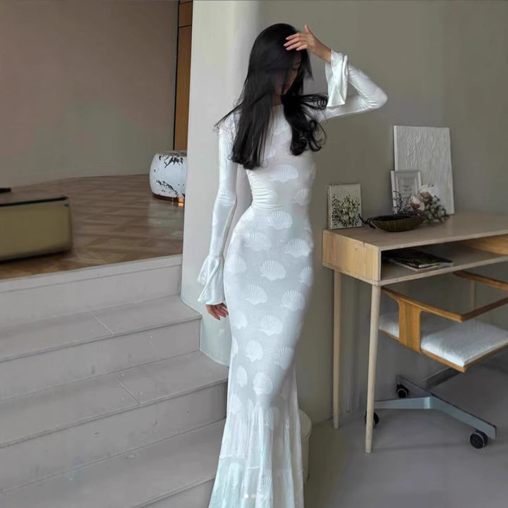 Women's form-fitting long dress with stylish shell design and elegant sleeve finish