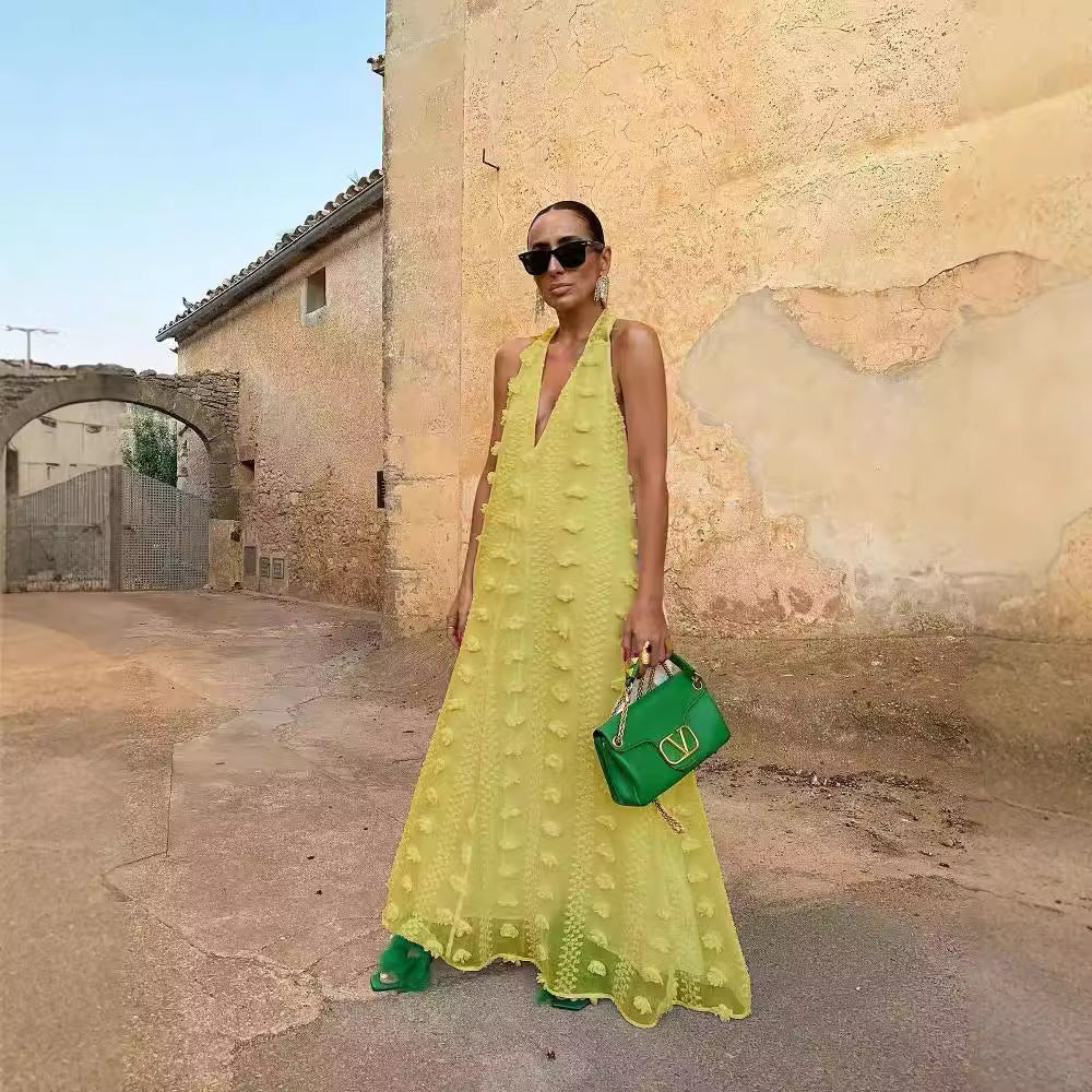 Women's maxi dress with volumetric texture details and deep V-neck