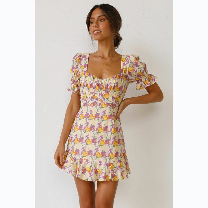 Women's mini dress with voluminous sleeves and playful ruffled hem