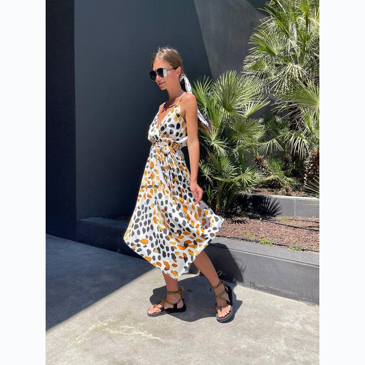 Women's maxi dress with elegant wrap design and stylish ruffle details