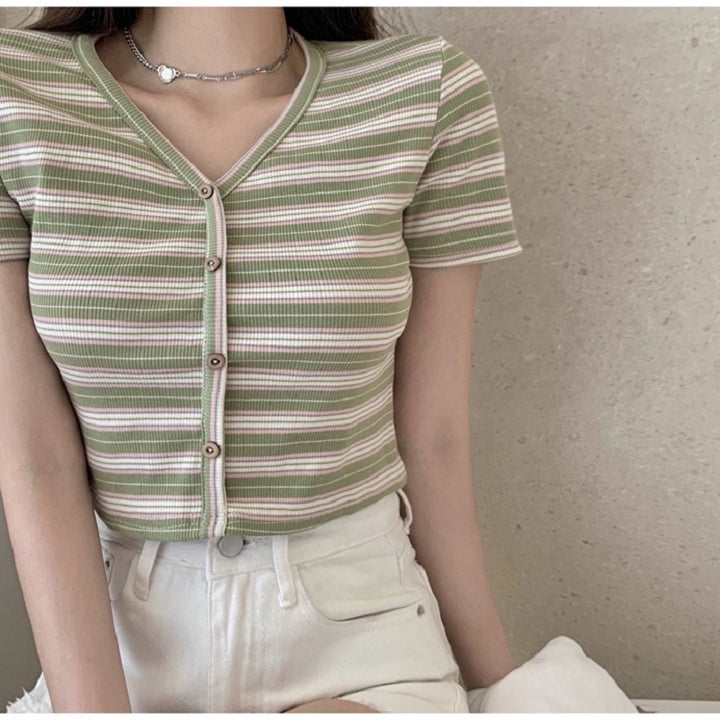 Women's cropped t-shirt with fashionable striped pattern and decorative buttons