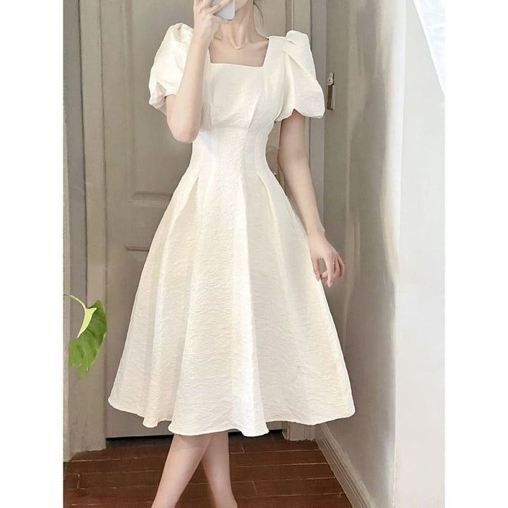 Women's elegant midi dress with square neckline and voluminous sleeves