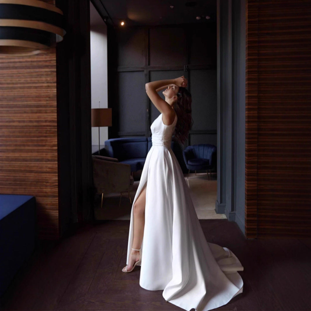 Women's elegant wedding dress with deep V-neckline and side slit
