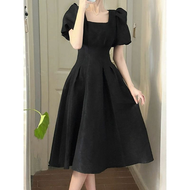 Women's elegant midi dress with square neckline and voluminous sleeves