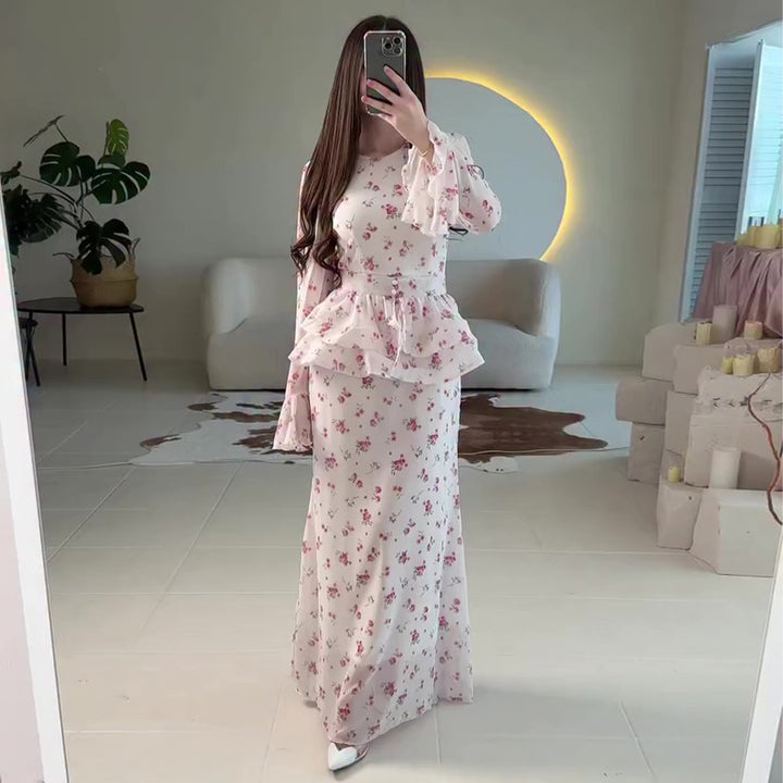 Women's maxi dress with voluminous peplum and floral accents