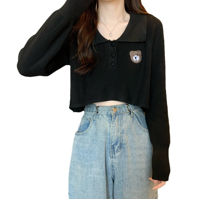 Women Cropped Pullover with a one-button closure and unicorn emblem