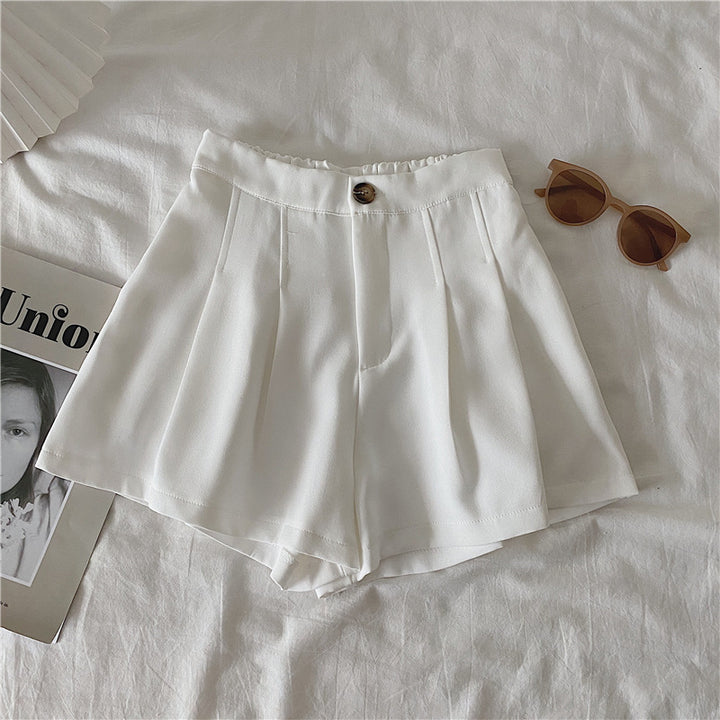 Women's elegant shorts with pleats and button detail