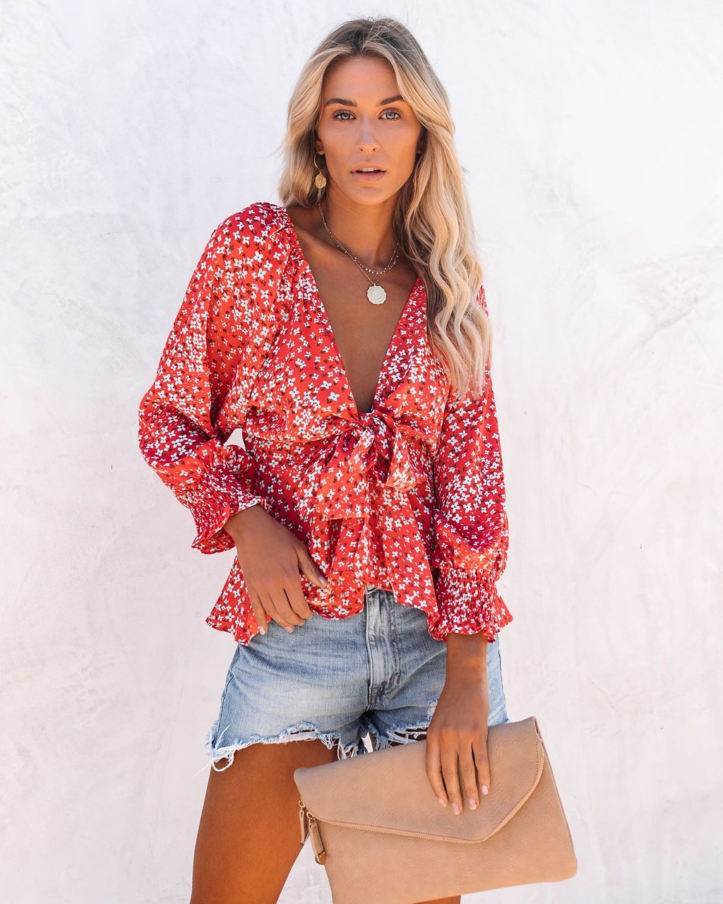 Ladies blouse top with playful floral pattern and elegant knot detail Lune London