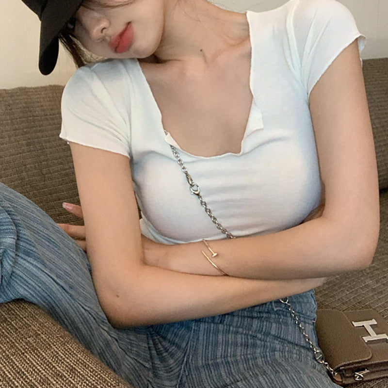 Women's short sleeve top with unique V-neckline and modern design