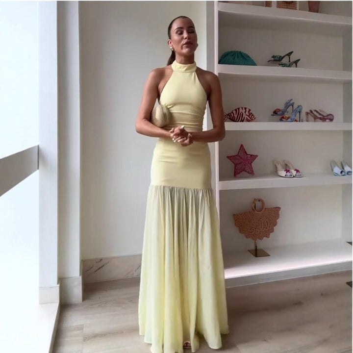 Women's maxi dress with high-neck design and flowing skirt