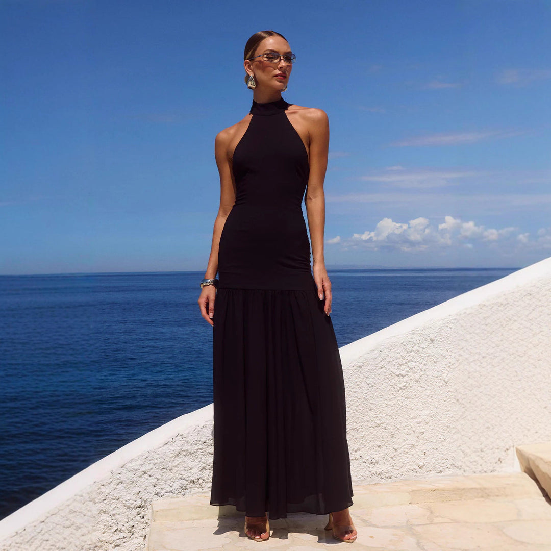 Women's maxi dress with high-neck design and flowing skirt