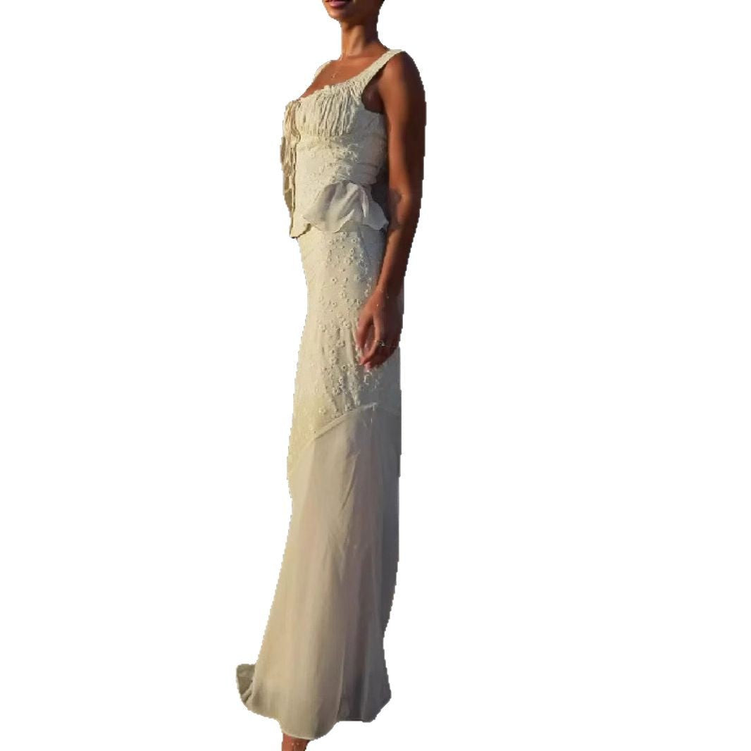 Women's elegant maxi dress with off-shoulder design and sophisticated ruffle details