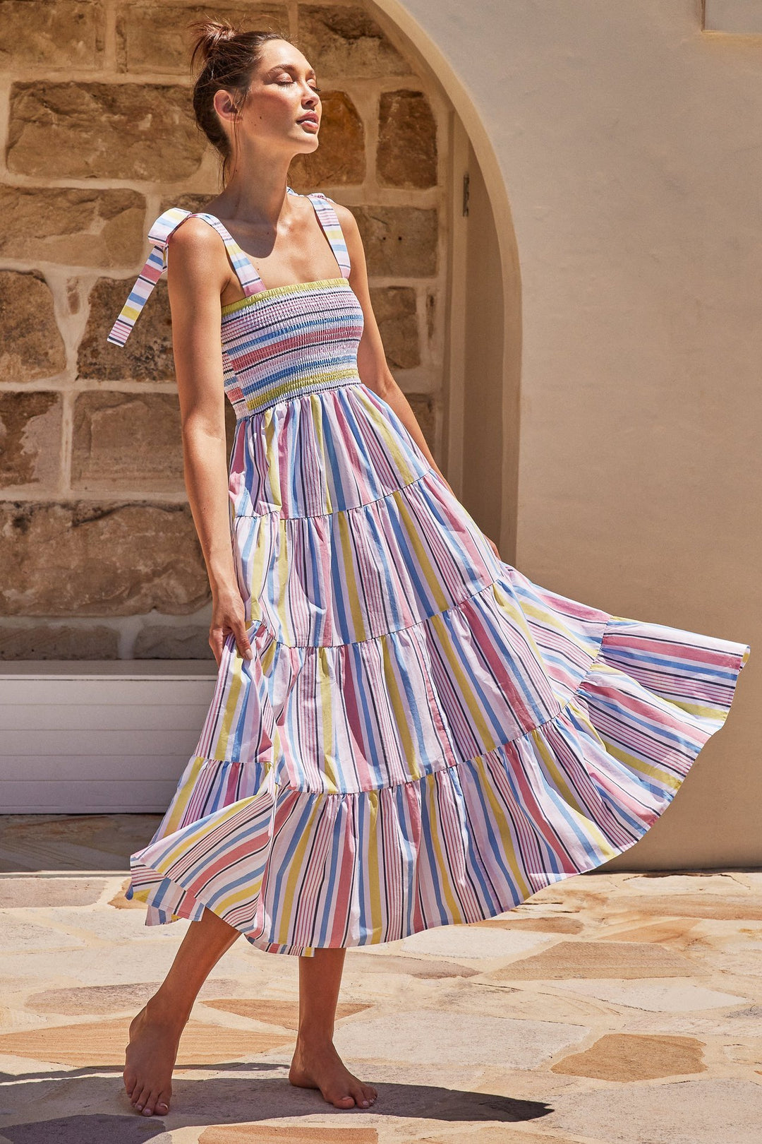 Women's maxi dress with flattering smocked top and playful straps