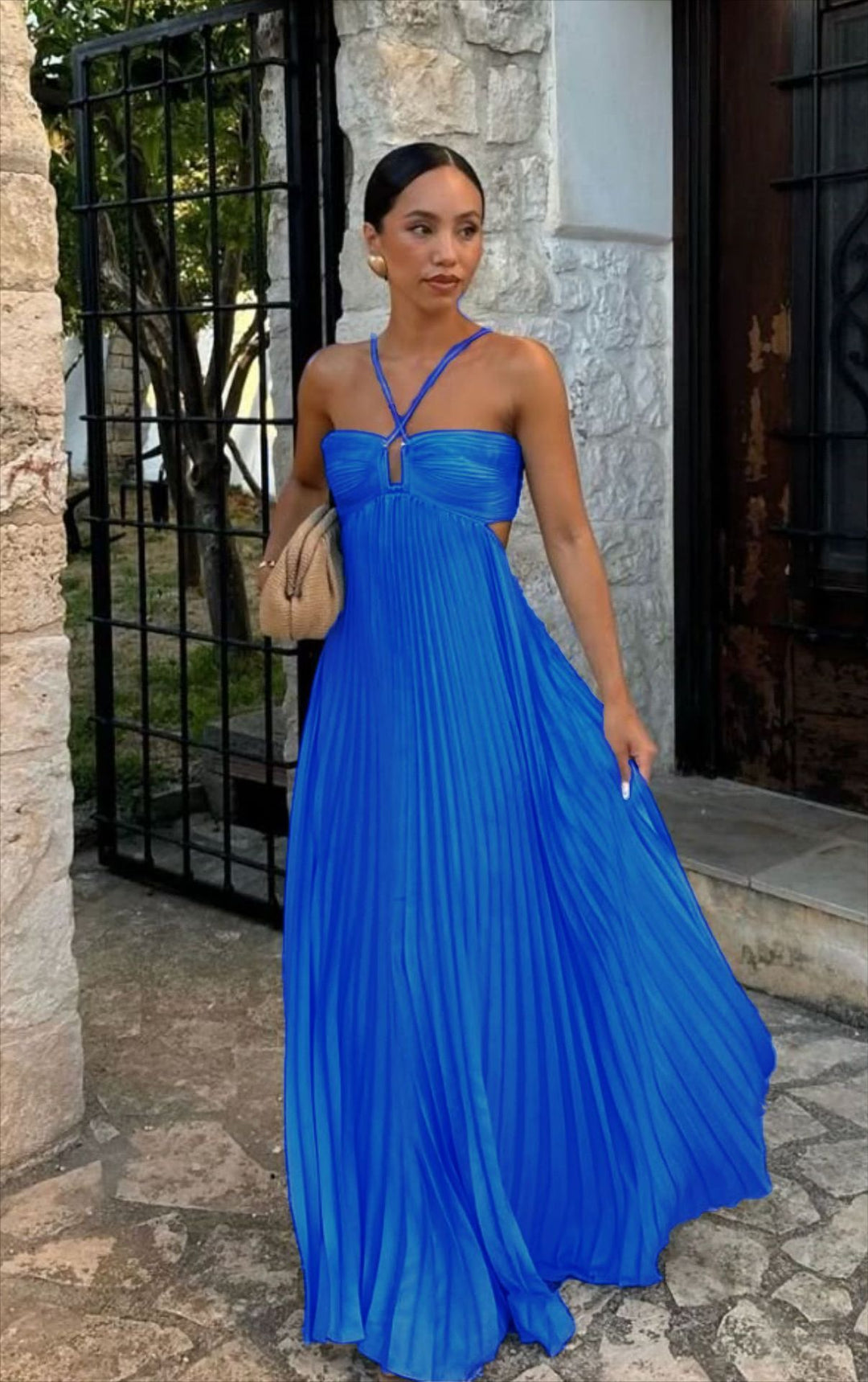 Women's pleated dress with off-the-shoulder design and refined strap details