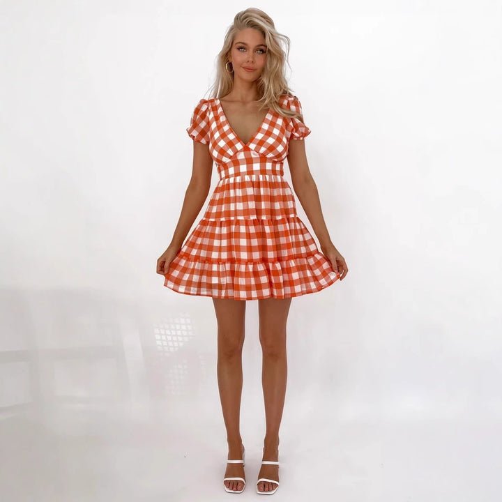 Women's casual dress with voluminous puff sleeves and playful hem Lune London