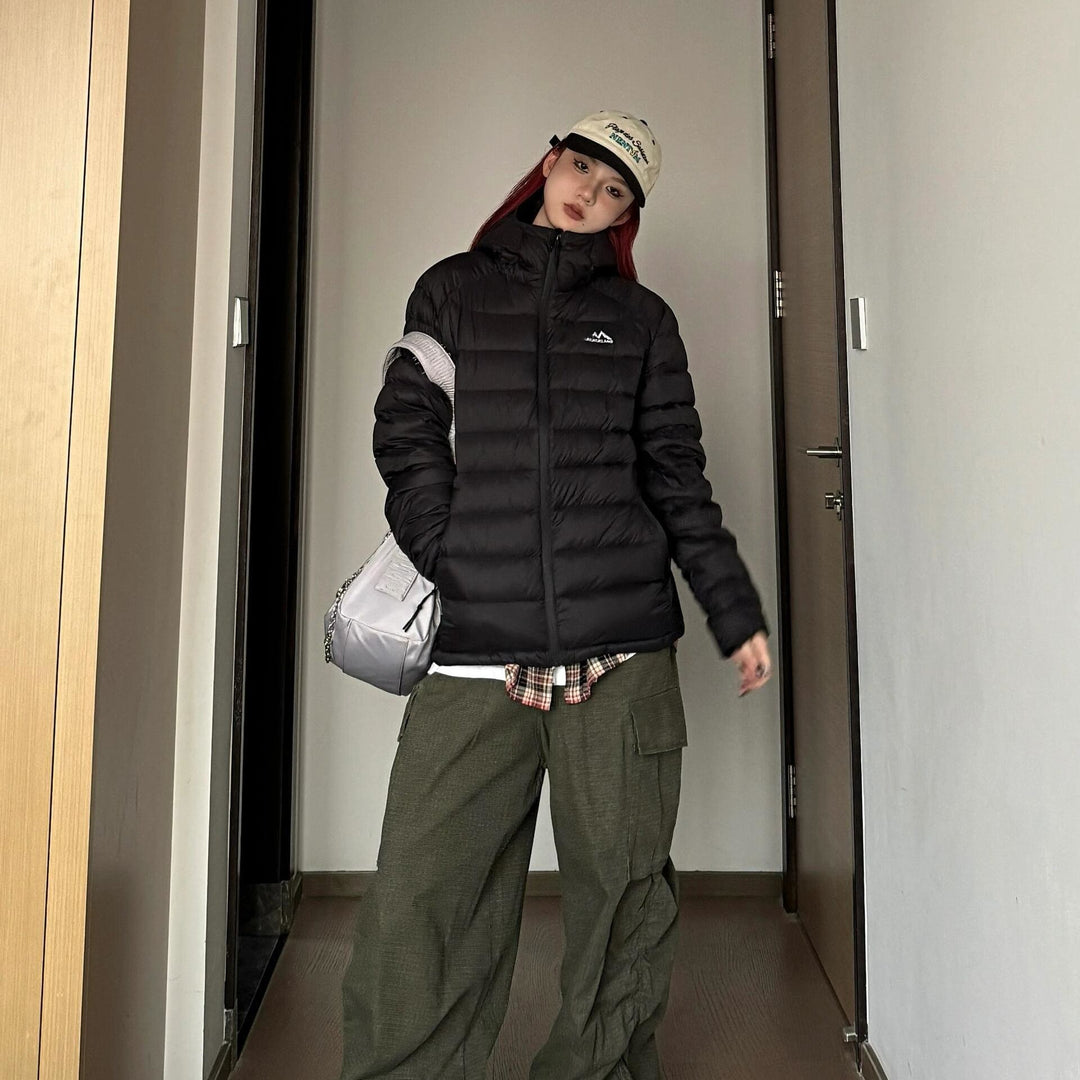 Women's quilted winter jacket with high collar and practical side pockets