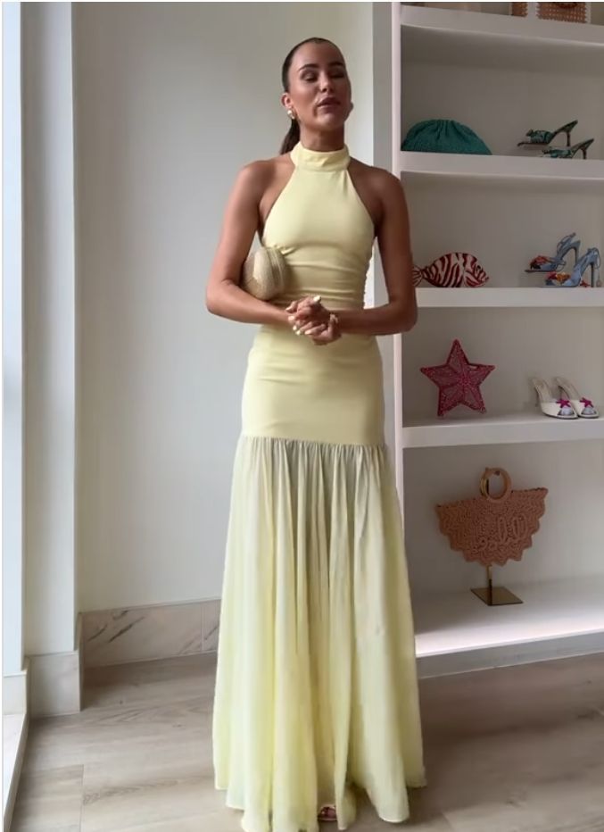 Women's maxi dress with high-neck design and flowing skirt