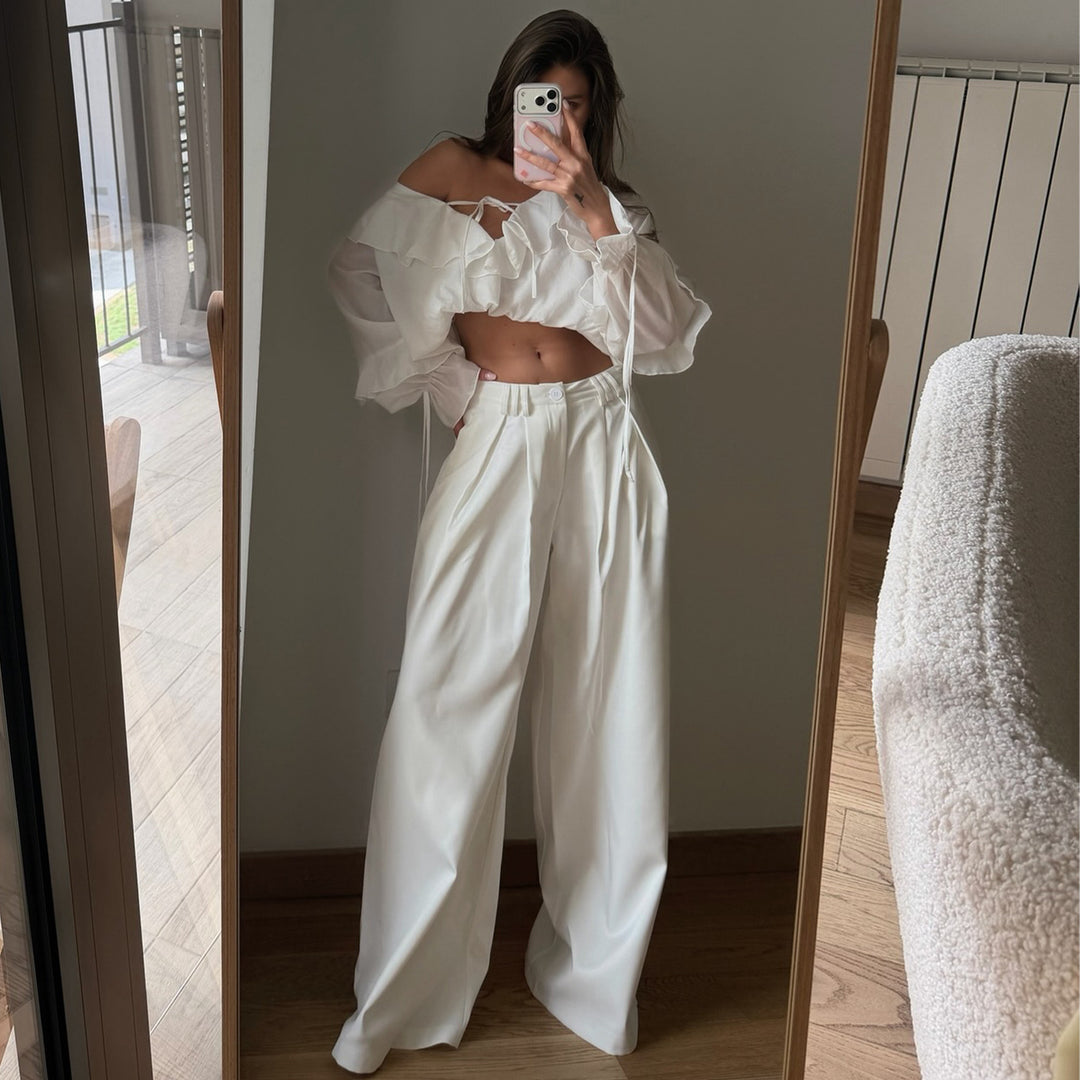 Women's blouse with voluminous ruffle details and captain sleeves