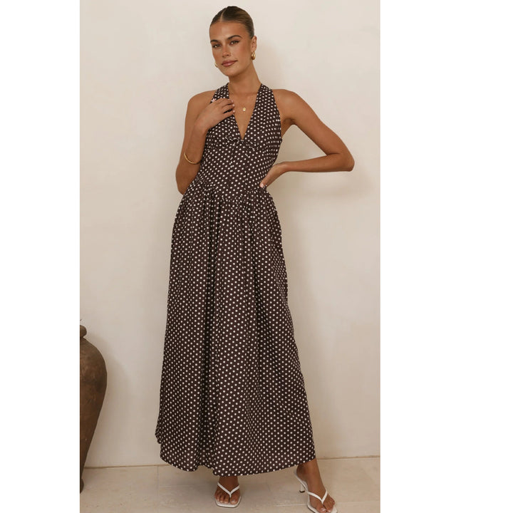Women’s maxi dress with deep V-neckline and playful polka dot pattern