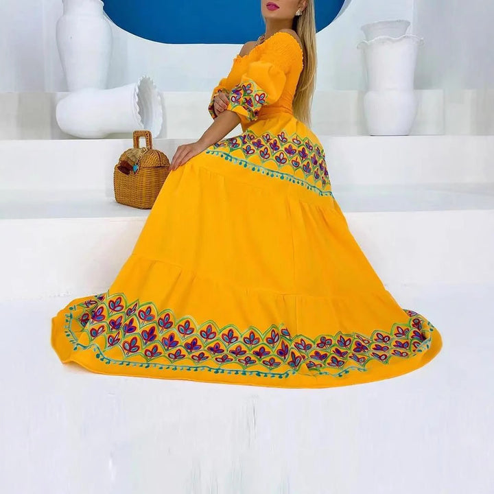 Women's Boho Maxi Dress with Off-the-Shoulder Design and Playful Embroidery Detail