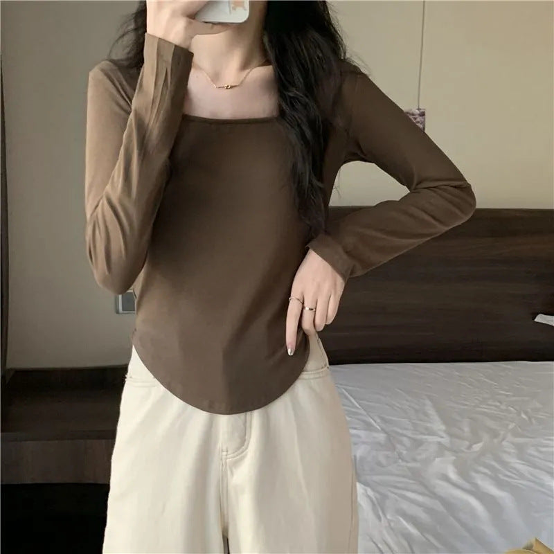 Women's long sleeve top with elegant square neckline and modern cut