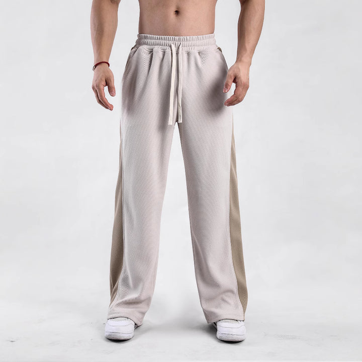 Men's sporty leisure pants with side ventilation openings and elastic waistband Lisslune