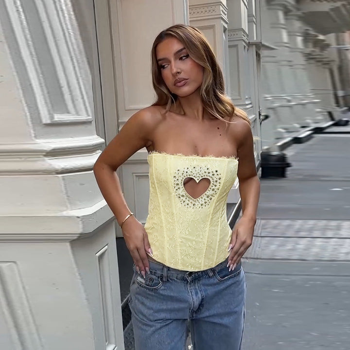 Ladies corset top with heart-shaped neckline and delicate lace embellishments