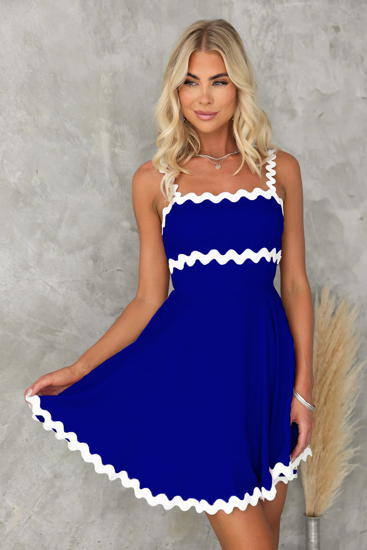 Women's casual dress with voluminous ruffles and decorative wave hem